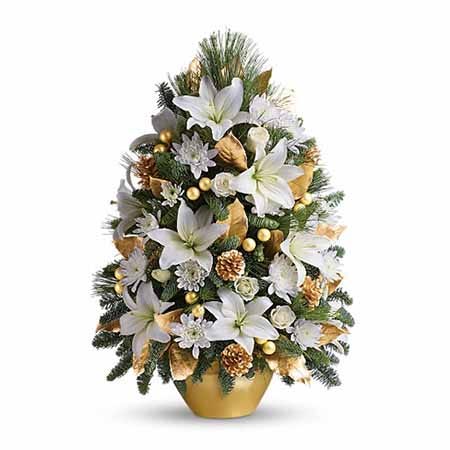 White lilies in a tiny christmas tree flower arrangement from send flowers