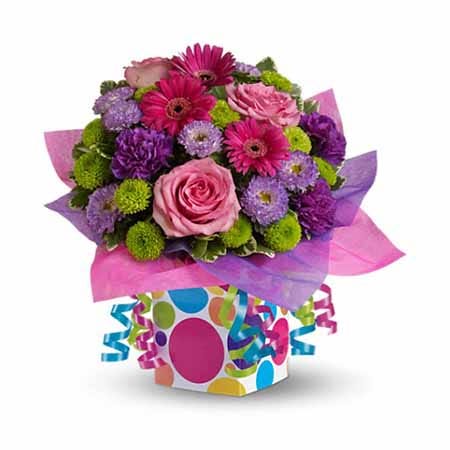 Multicolored confetti bouquet with multicolored flowers and party ribbon