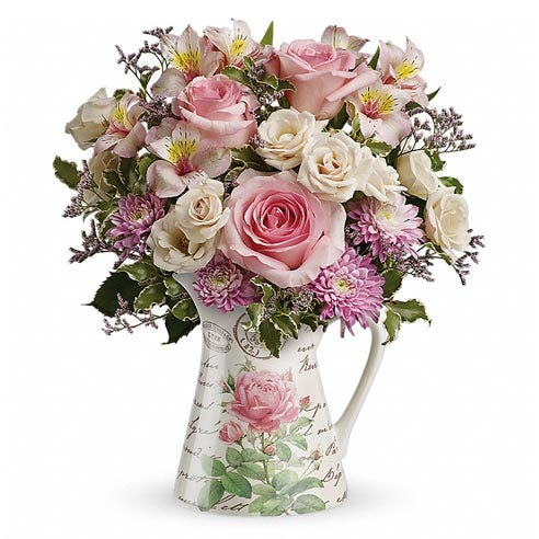 Floral print water pitcher with light-pink roses and pastel spring flowers