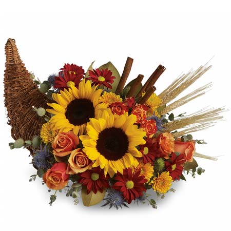 A Bouquet of Orange Roses, Sunflowers, Yellow Mums and Red Daisies in a Magnolia Leaves