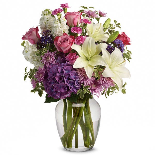 Spring white lily flower bouquet with white lilies, pink roses and spring flowers