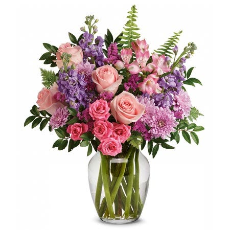 Spring flowers bouquet with pink roses, alstroemeria and pastel flowers