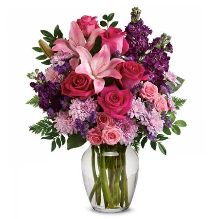 Romantic spring mixed flower bouquet with hot pink roses, lily and purple stock