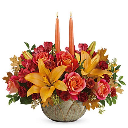 Yellow lily and orange fall candle centerpiece with 2 candles and bowl vase