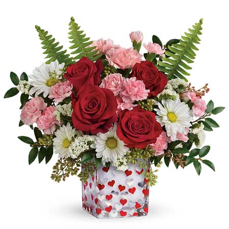 Valentines Day flower delivery with pink carnations, red roses and heart vase