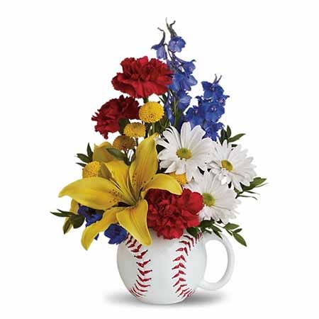 A Bouquet of Blue Delphinium, Yellow Asiatic Lilies, White Daisies, and Red Carnations in a Keepsake Sports Theme Cup with Card Message