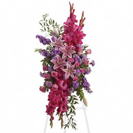 Pink oriental lily and pink rose oval funeral flowers standing spray with easel
