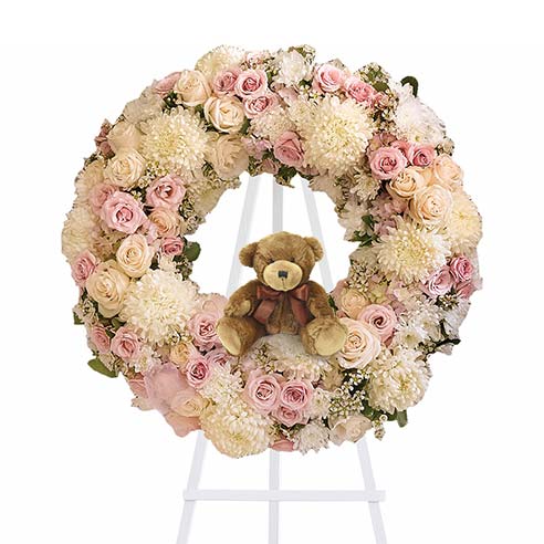 Baby girl funeral flowers standing spray wreath with teddy bear and easel