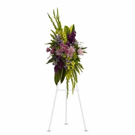 Oval shaped green cymbidium orchid and fuji mums funeral flower standing spray