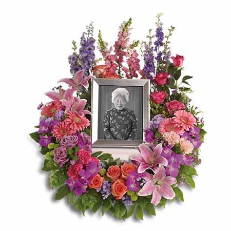 Picture frame funeral flowers arrangement bouquet with pastel flowers