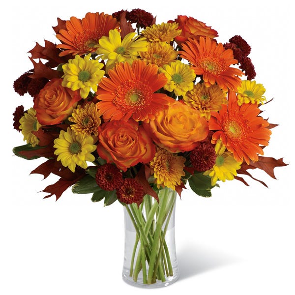 Orange flowers and orange roses featured in this orange flower bouquet
