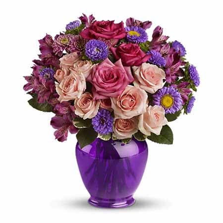 A Bouquet of Light Pink Roses, Hot Pink Roses, Lavender Alstroemeria, and Matsumoto Asters in a Deep Purple Ginger Jar Vase
