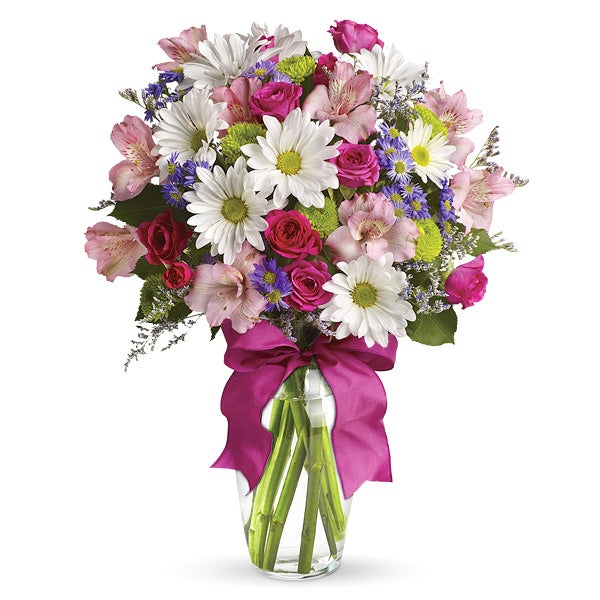 A Bouquet of White Daisies, Pink Spray Roses, Purple Monte Casino Asters and Green Button Spray Mums in a Clear Glass Vase