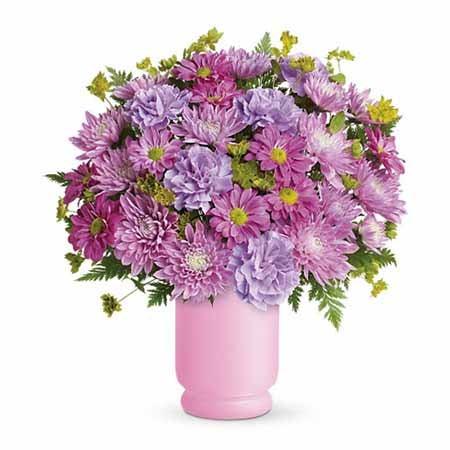 A Bouquet of Lavender Mums, Lavender Carnations, Pink Mums, and Green Bupleurum in a Pink Pedestal Design Vase