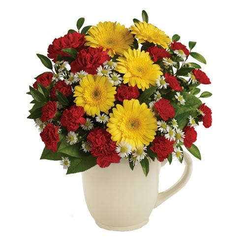 A Bouquet of Mini Yellow Gerberas, Red Carnations, Mini Red Carnations, White Monte Cassinos, Lemon Leaf and Huckleberry in a White Mug