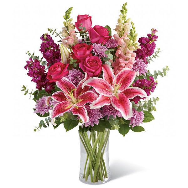Stagrazer lilies and hot pink roses with purple stock flowers and lavender chrysanthemums