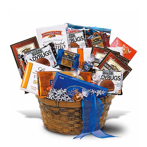 Sweet Delectable Baskets full of goodies including Lindt Lindor Balls, Truffle, Truffle Bar, Nikki's Cookies Ladybugs, Pepperidge Farm Milano Cookies, Russell Stover Chocolates, Hot Chocolate Packets, Chocolate-Covered Pretzels, Ghirardelli Bars And Squares in a Blue Woven Container with Ribbon