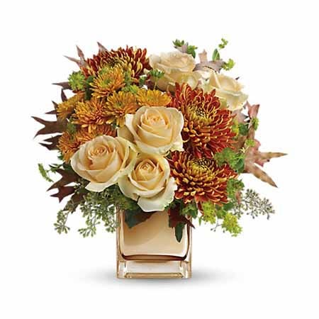 Romantic fall flower bouquet in bronze vase with pale peach roses and mums