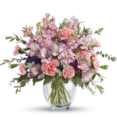 Lavender alstroemeria and pale pink carnations pastel flower bouquet in vase