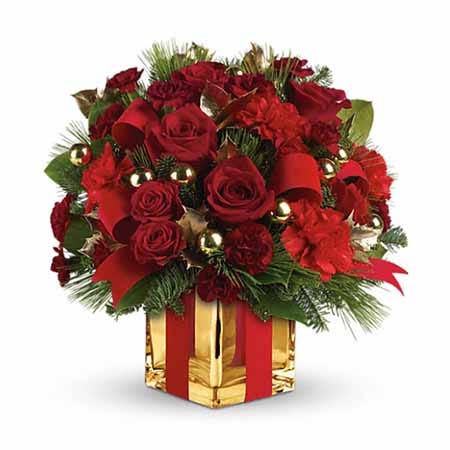 Red roses, red carnations and a gold square vase with a ribbon