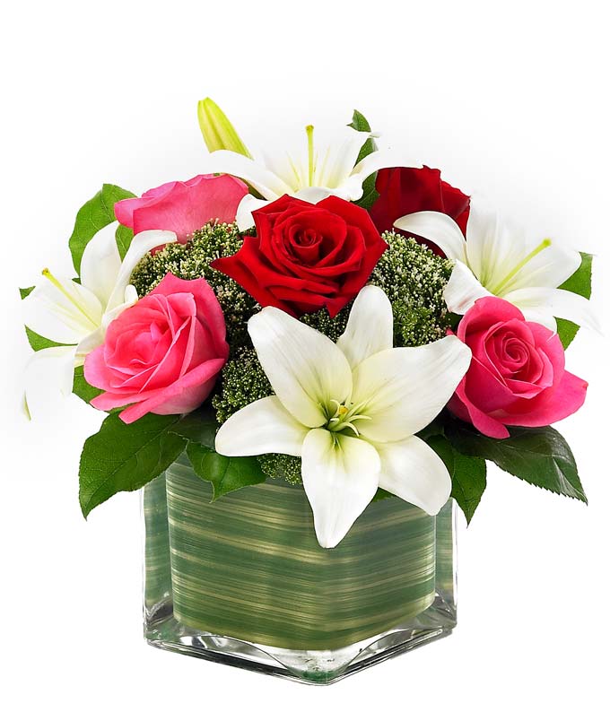 Pink Roses and red roses with white lilies Valentine's delivery in a square vase