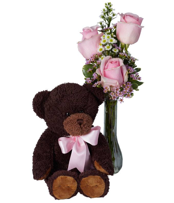 Long stem pink roses delivered in a bud vase with a teddy bear