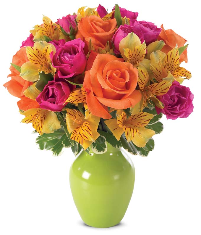 Orange roses and pink roses in a green vase for delivery