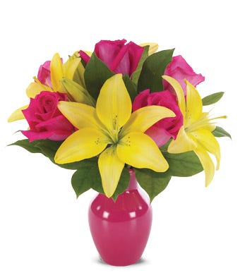 Yellow lilies and pink roses delivered in a pink vase today