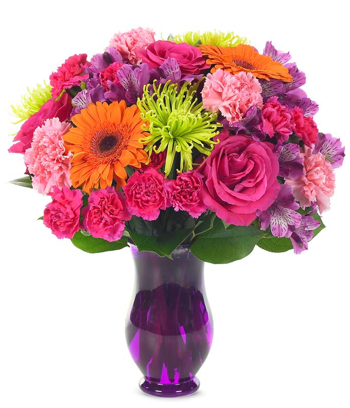 Hot pink roses with gerbera daisies in a purple vase