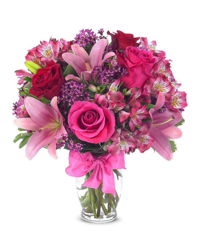 A Bouquet of Red And Pink Roses, Hot-Pink Asiatic Lilies, Fuchsia Alstroemerias in a Glass Vase with Bow with Message Card