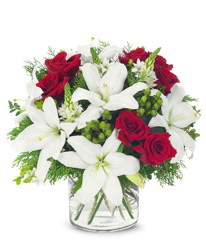 Modern Holiday flower arrangement with red roses and white lilies