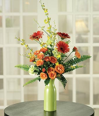 Orange Spray Roses, Orange Gerberas & Green Carnations in a Green Vase