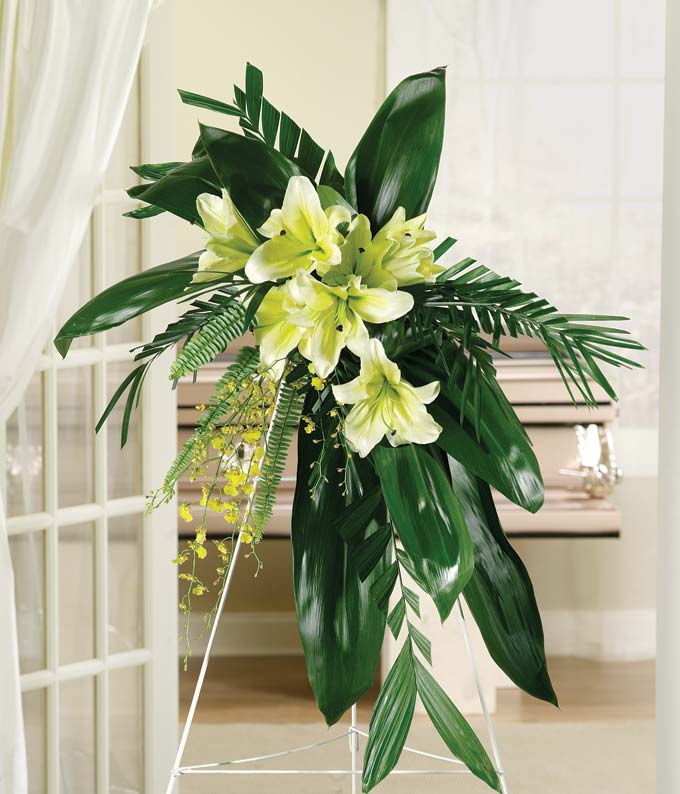 Yellow Stargazer Lilies, Orchids & Green Ti Leaves Standing Spray					