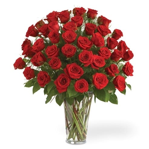 Three dozen red roses hand delivered in a glass vase