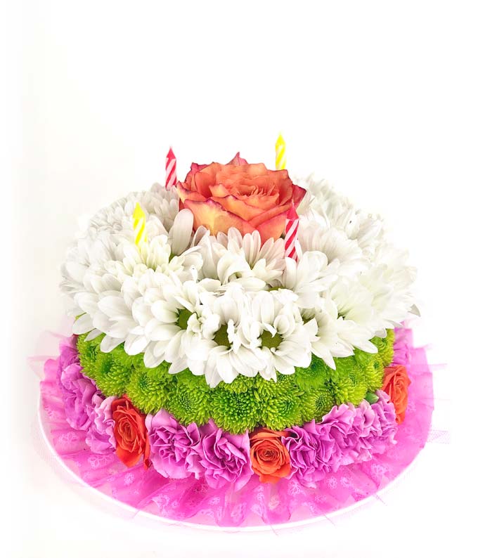 Birthday flower cake with pink carnations and white daisies