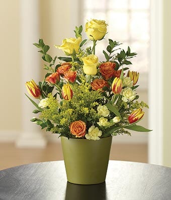 Yellow roses, orange spray roses and bicolor tulips