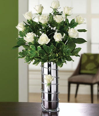 Long stem white roses in silver vase