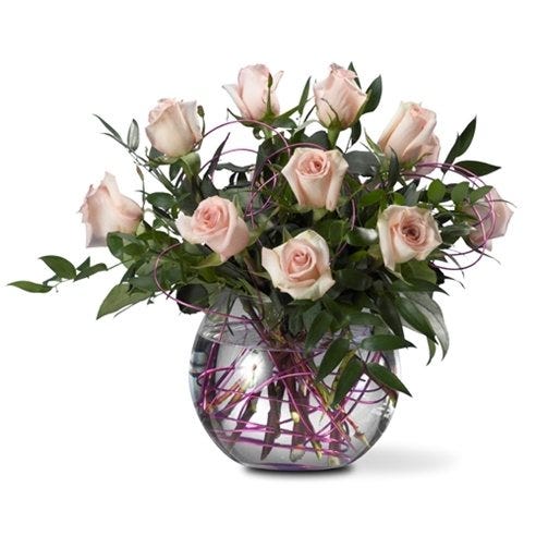 Link pink roses delivered by florist in a bubble bowl vase