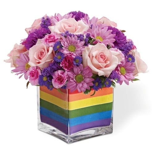 Purple Flowers in a Colorful Vase