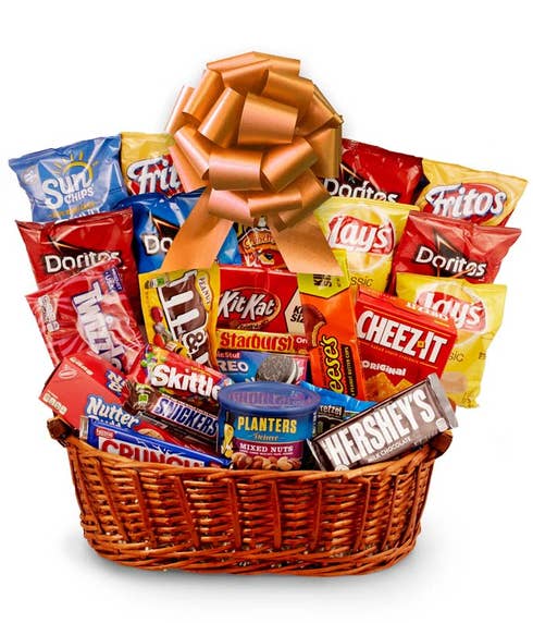 Halloween candy gift basket with cookies, chocolate bars, nuts, chips and more