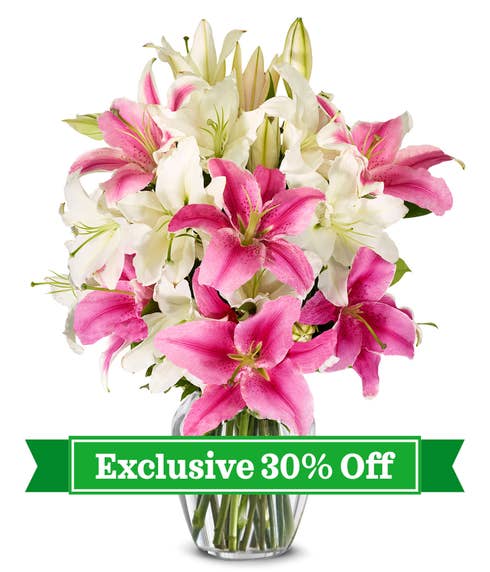 Bouquet featuring pink and white lilies, accompanied by a card message, with optional vase, securely delivered in a box.