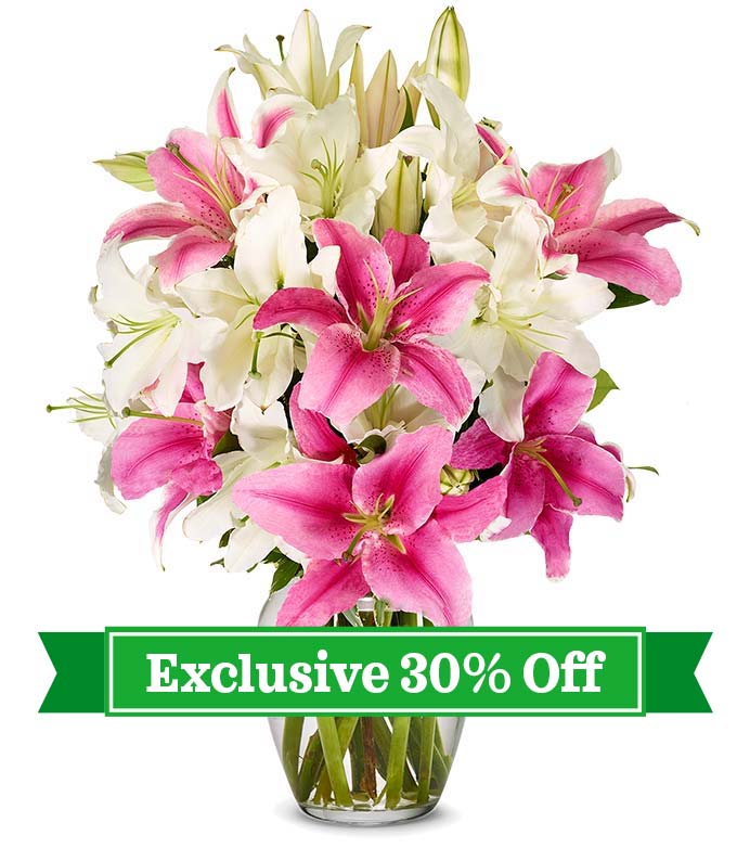 Bouquet featuring pink and white lilies, accompanied by a card message, with optional vase, securely delivered in a box.