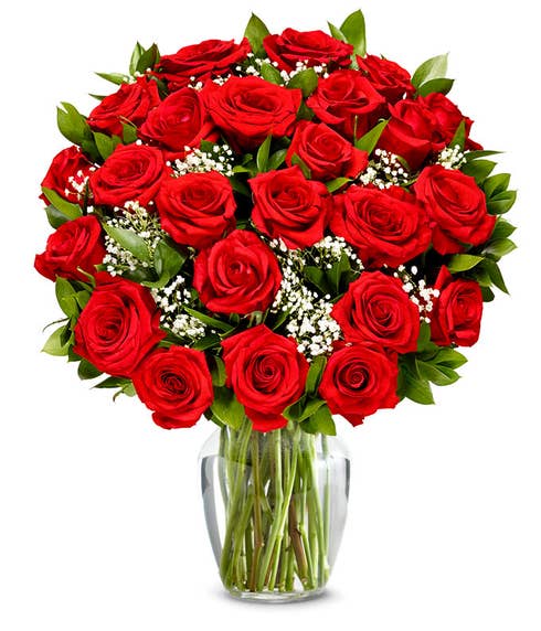 Two Dozen Red Roses in a clear glass vase.