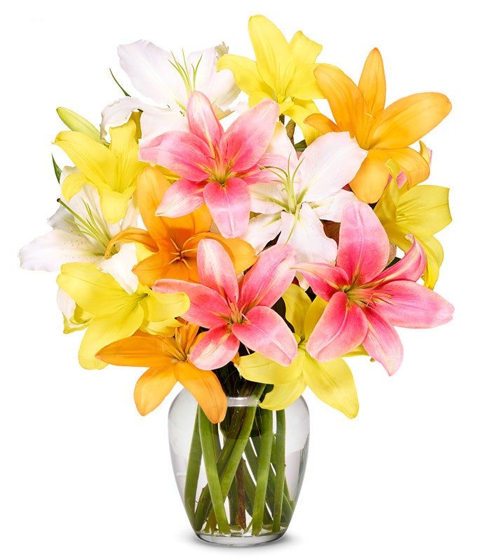 A Bouquet of Pink, Orange, Yellow, and White Lilies with Card Message Packaged Inside A Box Glass Vase  included Only if Added at Checkout