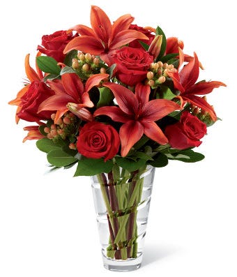 Send thanksgiving flowers this Fall with roses, lilies and hypericum berries.