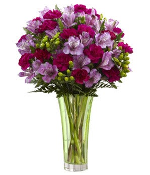 A Bouquet of Purple Peruvian Lilies, Magenta Mini Carnations and Green Hypericum Berries in a Keepsake Glass Vase