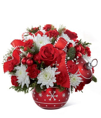 Red roses and red carnations delivered in christmas vase