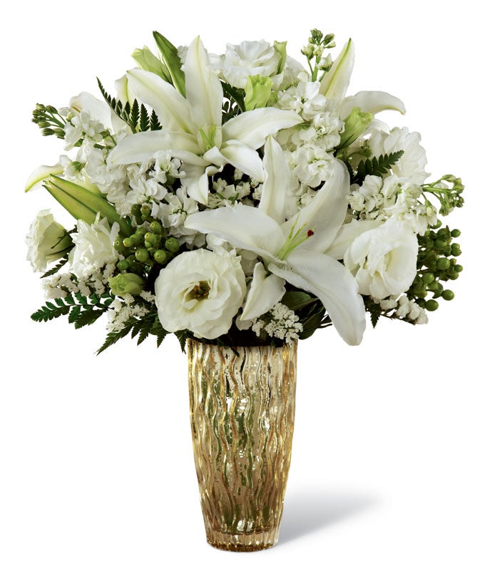 A Bouquet of White Lisianthus, White Lilies, White Statice, and White Stock in a Modern Glass Vase
