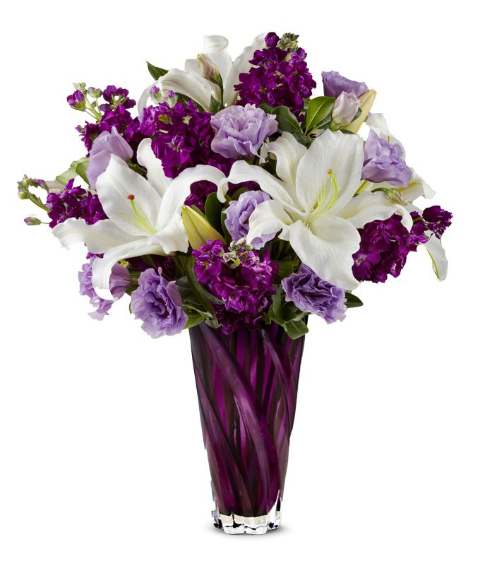A Bouquet of Lavender Double Lisianthus, Ivory Oriental Lilies and Purple Ruffled Gilly in a Deep Purple Glass Vase