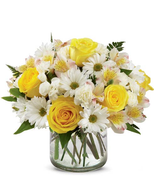 Yellow roses, Rosario Peruvian lilies, white traditional daisies, and white carnations